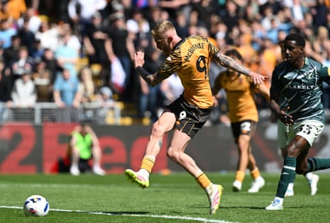 Oliver McBurnie tucks the ball home to give Hull the lead against Norwich.