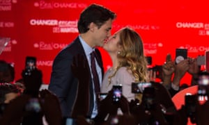 Prime minister Justin Trudeau kisses his wife Sophie as they arrive on stage in Montreal on on 20 October after winning the general elections.