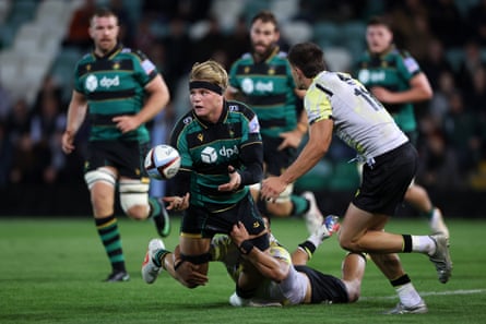 Henry Pollock of Northampton Saints offloads the ball during the pre-season friendly match between Northampton Saints and Black Lion