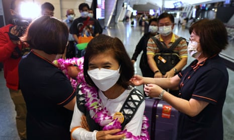 Travellers from Thailand arrive at an airport in Taiwan