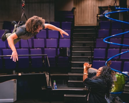 Darcy Braimoh hoist in the air during rehearsals for Little Mermaid