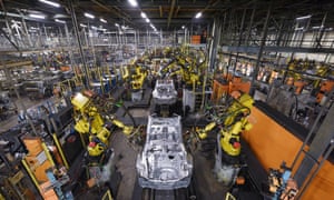 Robots weld vehicle panels in the Sunderland plant.