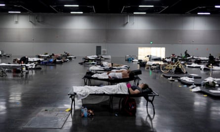 People sleep at a cooling shelter set up during a heat wave in Portland.