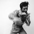 The artwork for Thrasher, a black and white image depicting Brandon Flowers pretending to spar