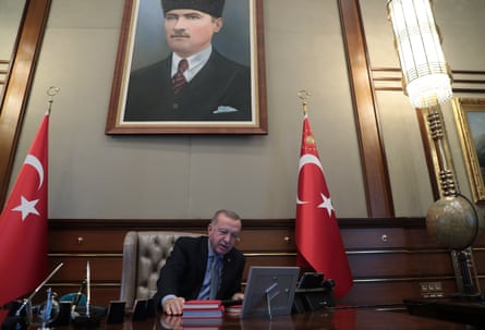 President Recep Tayyip Erdoğan speaks on video phone with the defence minister, Hulusi Akar, to give the order for an operation in Kurdish areas in morthern Syria, in Ankara, on Wednesday.