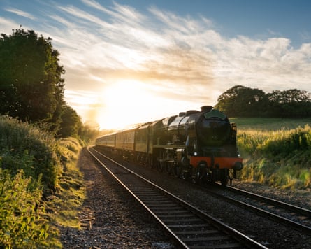 Steam train at sunset, in the Surrey hills.