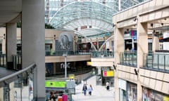 People walk through the Trinity shopping area of Leeds city centre. 