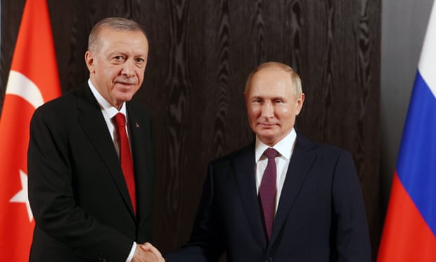 The Turkish president, Recep Tayyip Erdoğan greets his Russian counterpart, Vladimir Putin in Uzbekistan last week