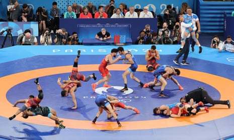 A digital composite of wrestling events at the Paris Olympics to be staged at Champs-de-Mars Arena.