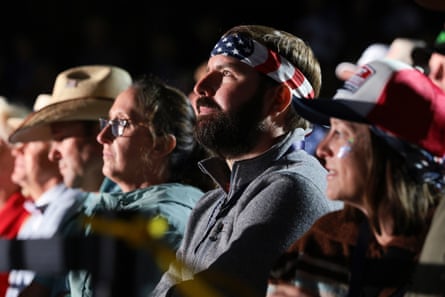 Supporters listen as Donald Trump speaks during a rally at Mount Rushmore National Memorial.