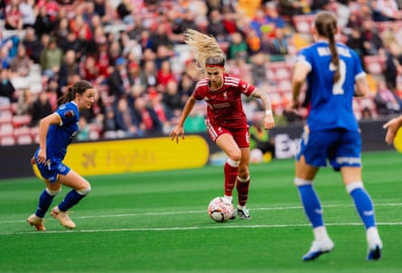 Natalia Ramos dribbles the ball between two Everton players during the Women's Super League match between Liverpool and Everton