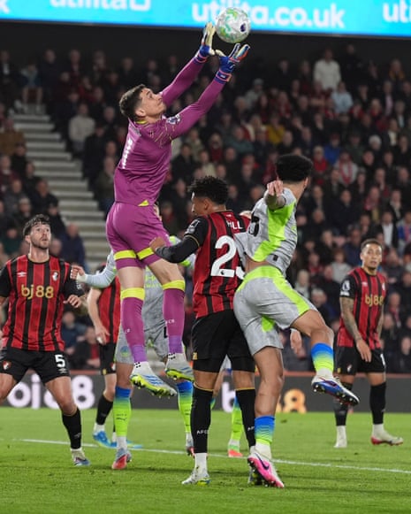 Bournemouth keeper Djordje Petrovic attempts to pluck the ball out of the air.