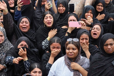 Women in mourning clothes at a funeral