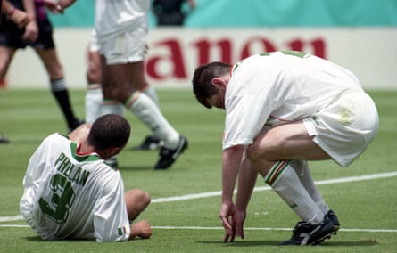 Terry Phelan and Denis Irwin autumn to nan turf astatine nan extremity of nan match.