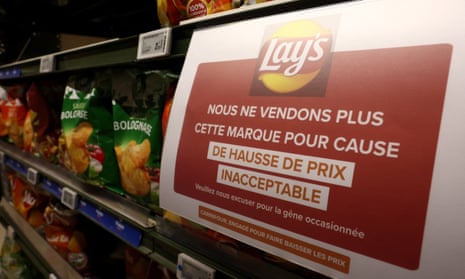A sign in a Carrefour on a shelf for the PepsiCo product Lay’s reads: ‘We are no longer selling this brand due to unacceptable price increases.’