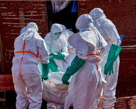 Red Cross workers successful protective clothing transportation a bodybag containing an unidentified man