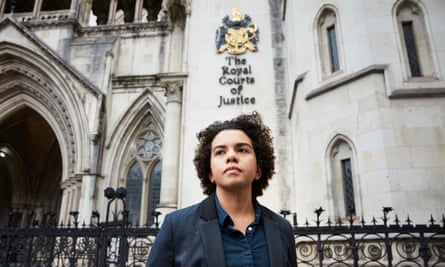 Keira Bell stands outside the entrance tot he Royal Courts of Justice