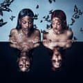 The album artworks shows the women looking at their reflections in an ink-black pool