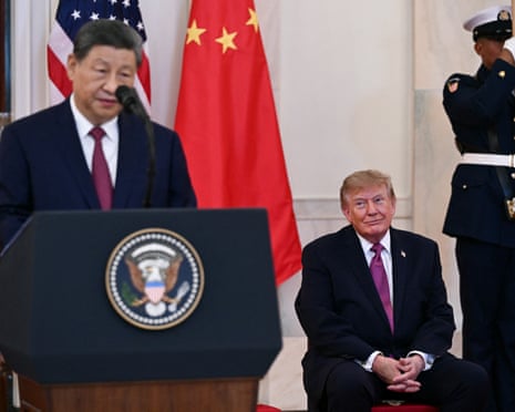 Donald Trump looks on as China’s president Xi Jinping delivers remarks in the Cross Hall of the White House.