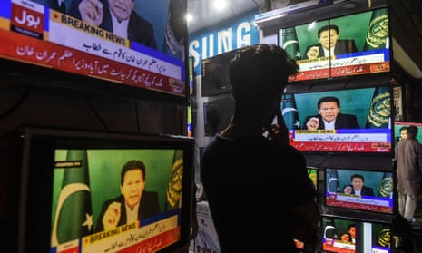 A shopkeeper watches Pakistan’s prime minister Imran Khan on television, Karachi, March 2021