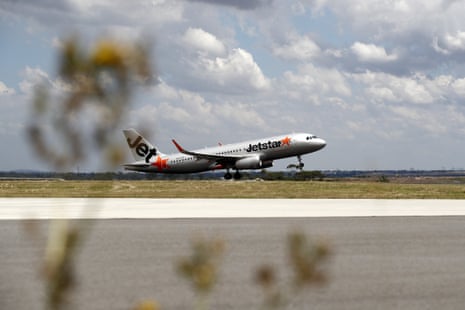 A Jetstar plane takes off on a Melbourne airport runway