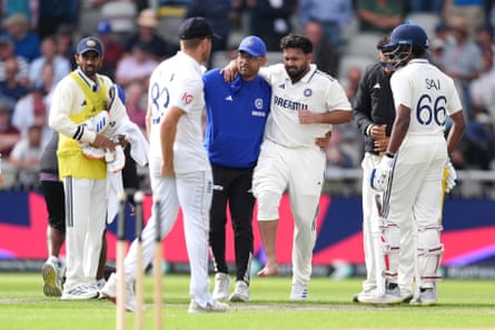 Rishabh Pant is helped off the field a being struck by a ball on the foot at Old Trafford last year.