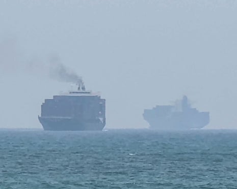 Cargo ships anchoring near the strait of Hormuz off the UAE’s eastern coast on Sunday.