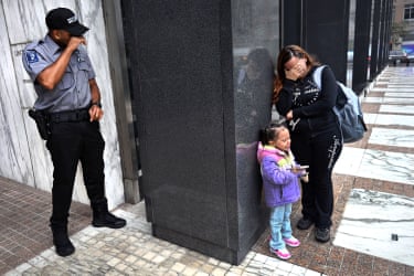 A security guard breaks down while witnessing a family separation in New York