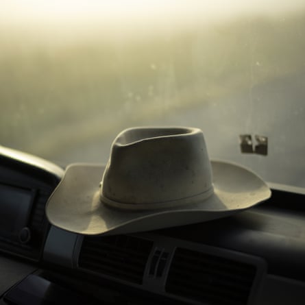 Groul Hat sits on the dashboard of his truck as he moves Camargue's bulls from one pasture to another