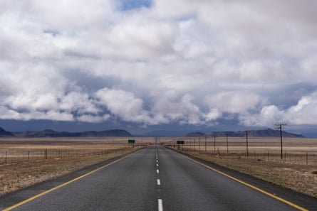 An empty road stretching out across the desert