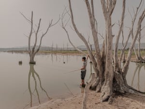 Skander Khlif – The Pulse of the Land A boy plays on a dam in the Beja region of Tunisia, where according to local organizations, water levels have been critically low for several years, highlighting the ongoing struggle against water scarcity