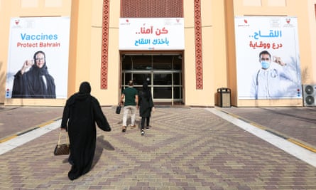People arrive to receive Sinopharm Covid-19 vaccines in Bahrain, 19 December.