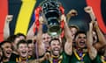 Australia's James Tedesco (centre) lifts the Rugby League World Cup trophy