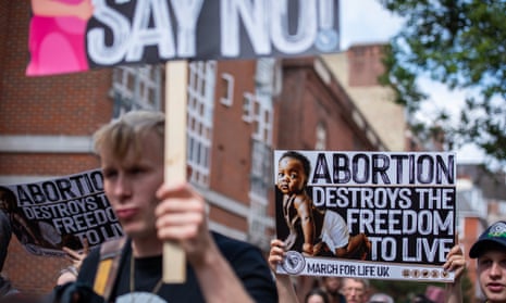 Protesters carrying placards reading: ‘Abortion destroys the freedom to live – March for Life UK’.