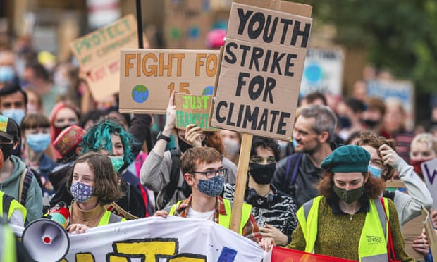 Protesters take part in a climate protest in Glasgow as part of the Global Youth Strike For Climate in the lead up to COP26 climate summit in the city.