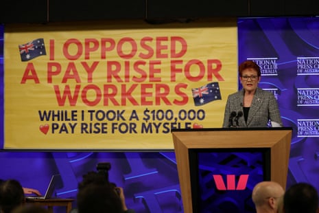 A protest banner appears during Pauline Hanson's address at the Press Club in Canberra
