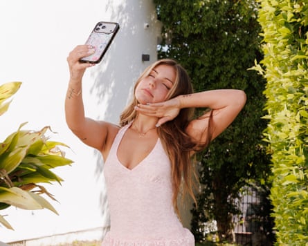 Piper Rockelle taking a selfie in a sunny garden