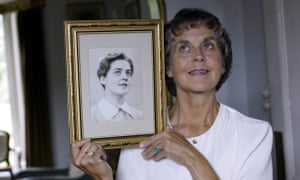 Jennifer Worth with a photograph of herself as a midwife in the 1950s.