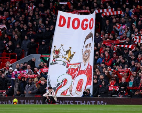 Liverpool fans hold up a banner of Diogo Jota during their match against Wolves.