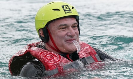 Davey spitting water in a pool