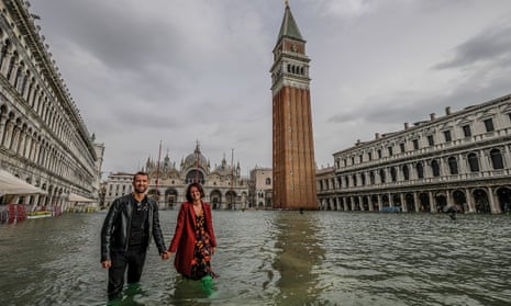 Tourists brave the flood water in St Mark’s Square, Venice, in October last year.