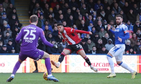 Will Osula of Sheffield United slots the ball home to open the scoring at Gillingham.