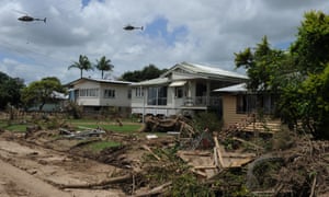 Two Australian Defence Force helicopters fly over the devastated township of Grantham in the aftermath of the floods in 2011.