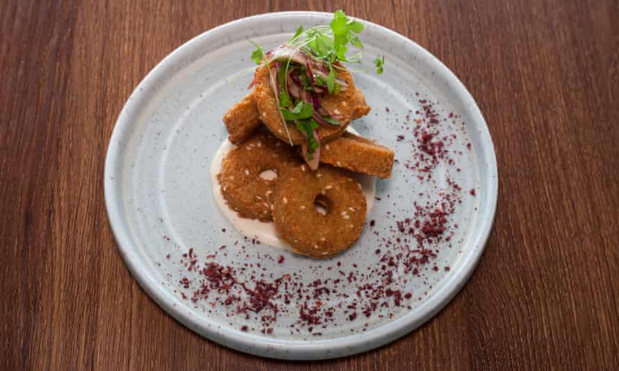 ‘Sesame-seed studded falafel are shaped as thick discs with a hole in the middle’: falafel.