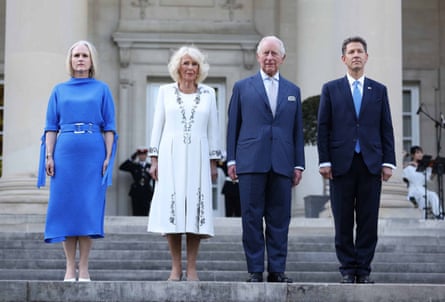 Claire Turner, the queen, the king and Christian Turner standing on steps