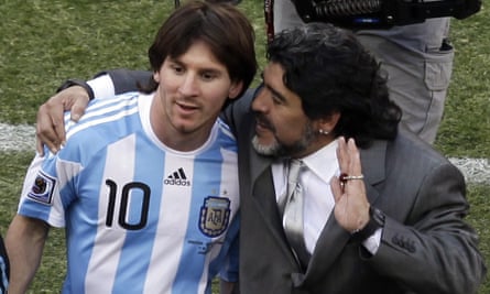 Lionel Messi (left) leaves the pitch with the Argentina head coach Diego Maradona after a 4-1 win over South Korea at the 2010 World Cup.