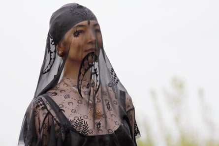 A model wearing a veil which prominently features the crescent moon logo at the spring/summer 20 show.