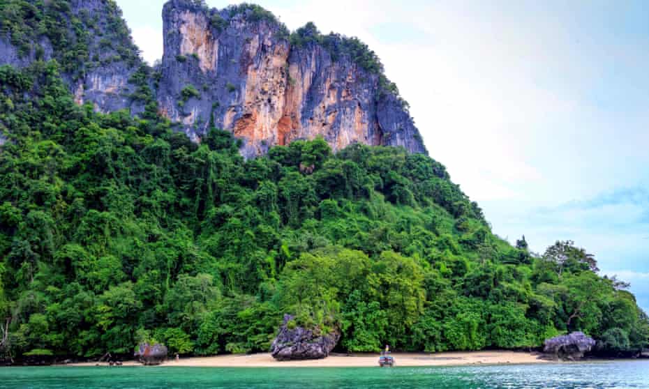 A longtail boat moored on the beach of one of the Koh Hong islands in the Andaman Sea