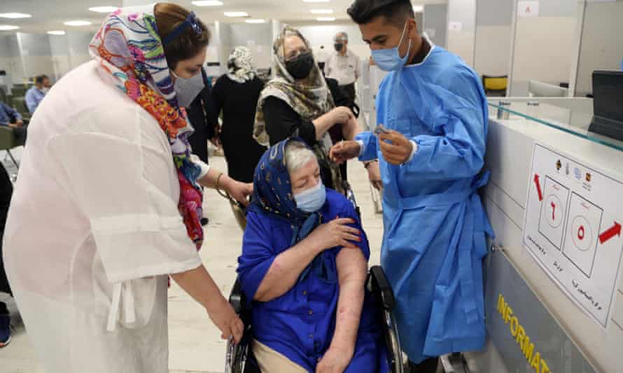 elderly women and medical staff