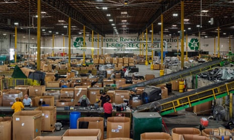 Employees sort through waste at the Electronics Recyclers International facility in Fresno, California